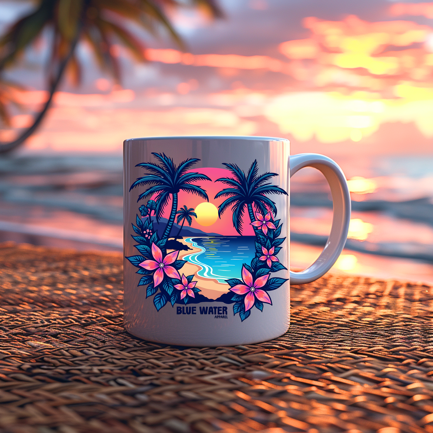 tropical sunset coffee mug sitting on a wicker mat with the beach sunset in the background by blue water apparel