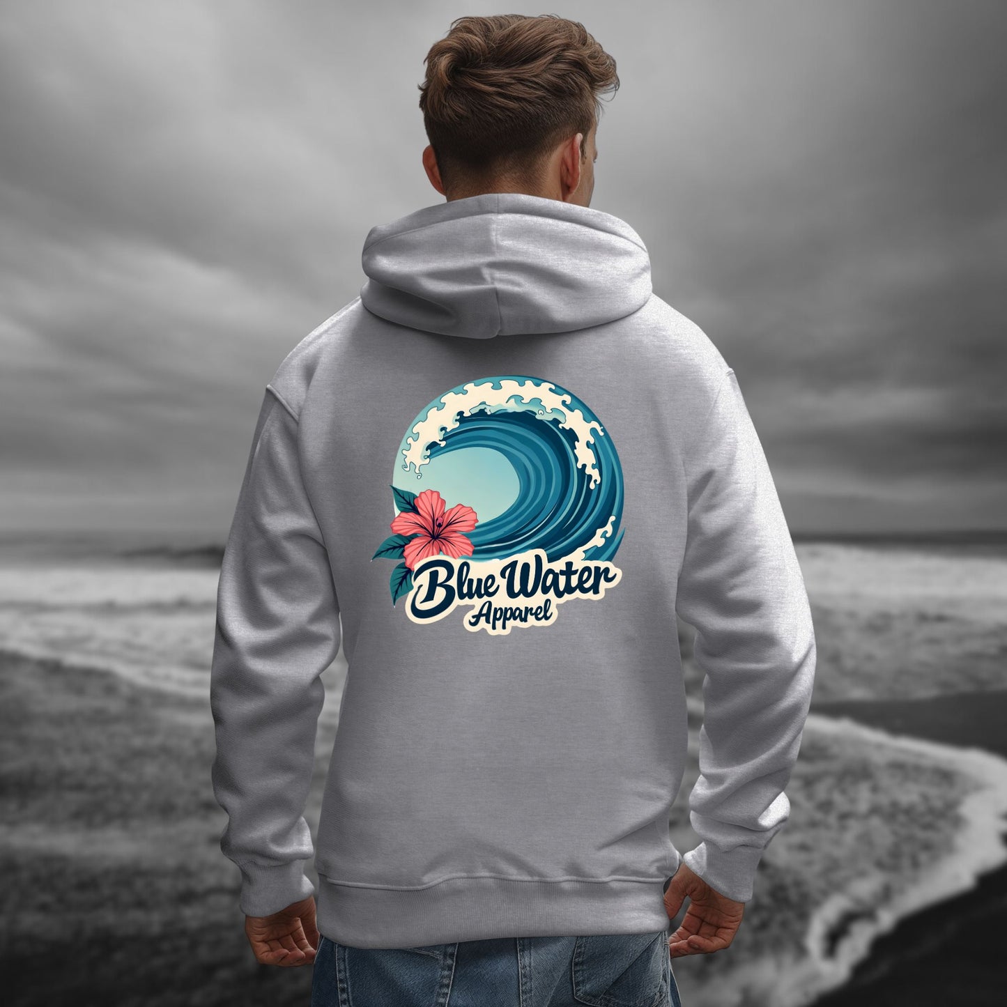 model on beach wearing sport grey hibiscus wave hoodie by blue water apparel