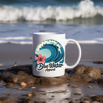 hibiscus wave coffee mug on beach by blue water apparel