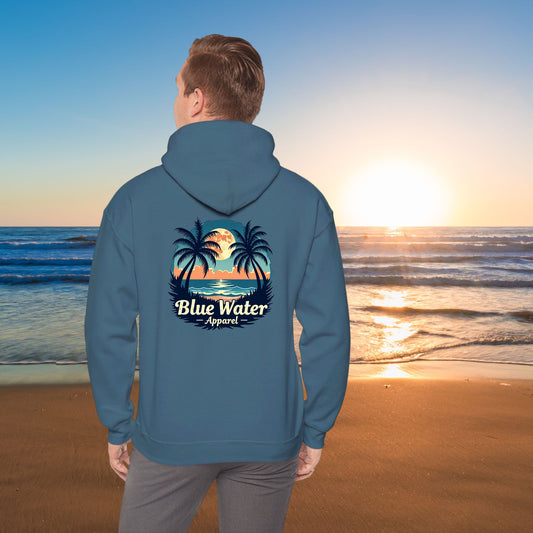 model on beach wearing indigo blue tropical moon hoodie by blue water apparel