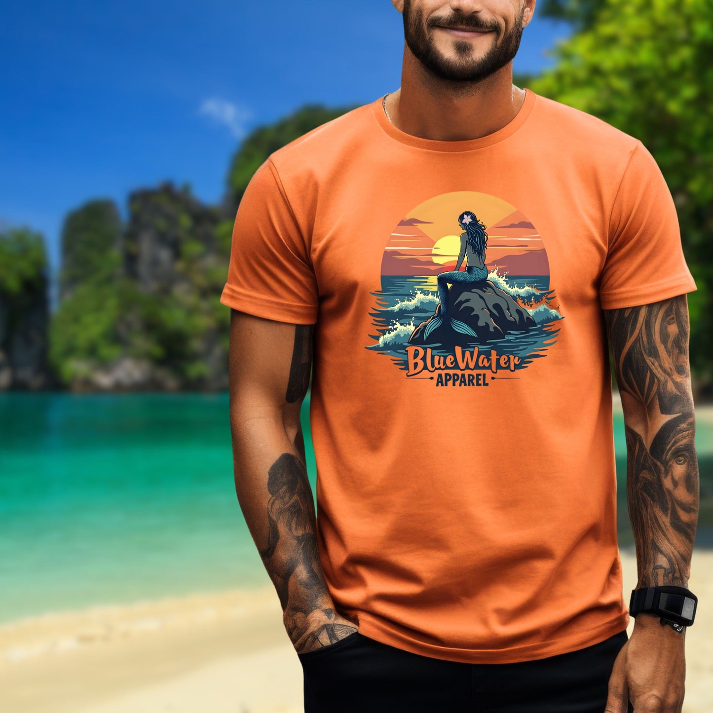 model on island wearing orange mermaid sunset tee by blue water apparel