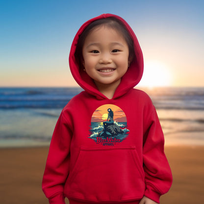 child model on beach wearing red mermaid sunset kids hoodie by blue water apparel