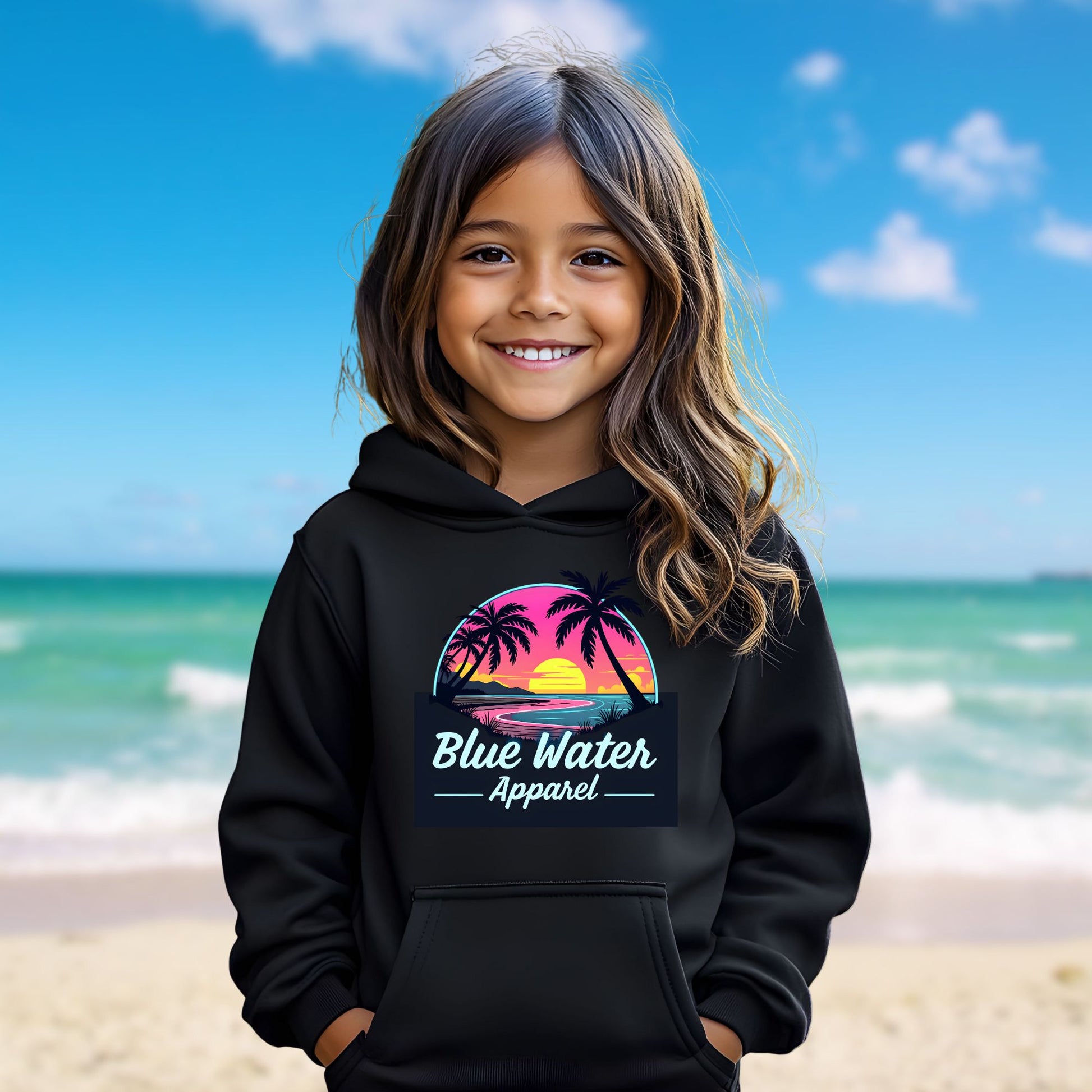 female model on beach wearing black neon sunset kids hoodie by blue water apparel