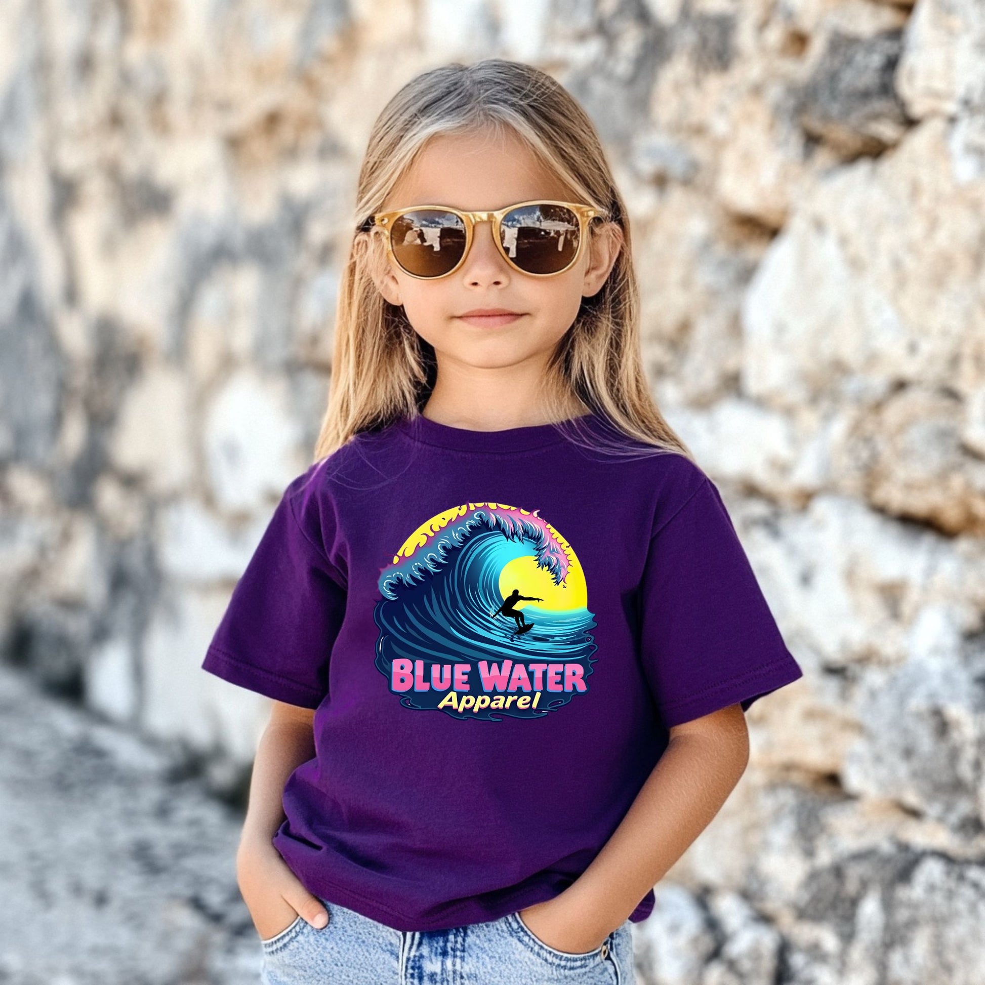 child wearing sunglasses and purple neon surfer tee by blue water apparel