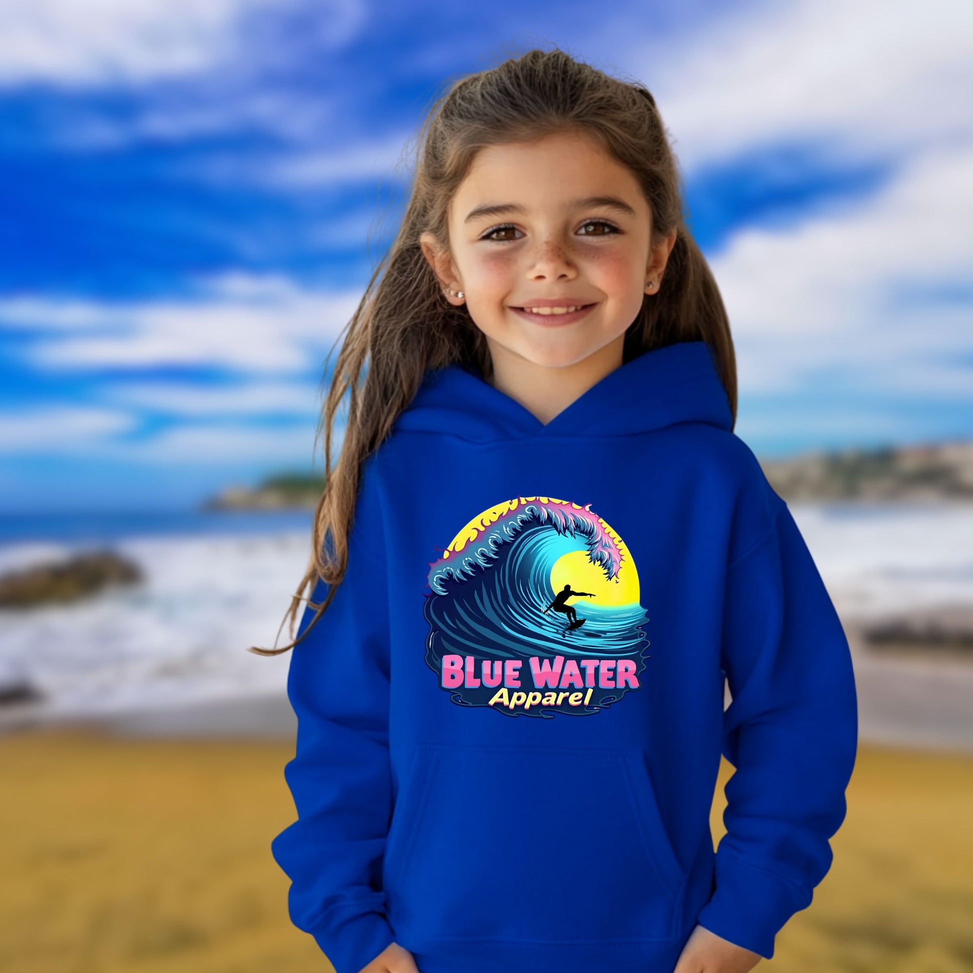 female model  on beach wearing royal neon surfer kids hoodie by blue water apparel
