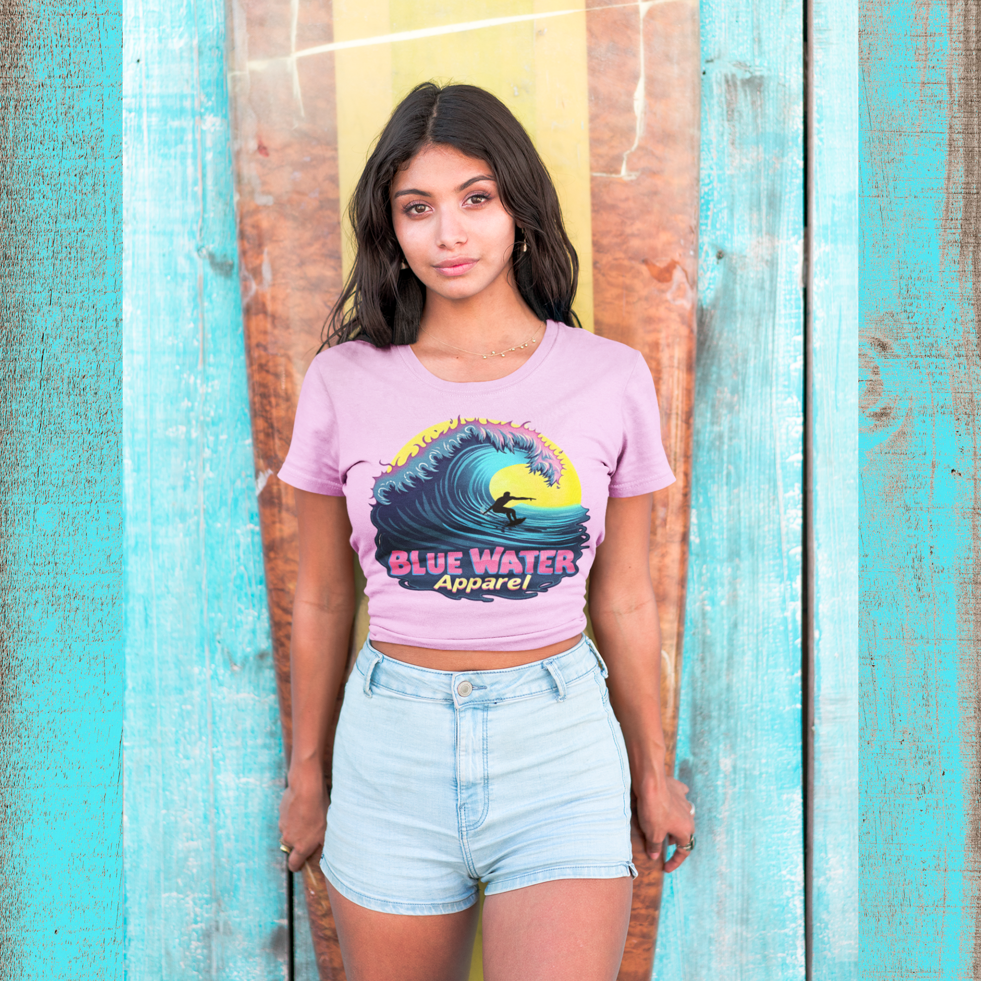 model with surfboard wearing lilac neon surfer tee by blue water apparel
