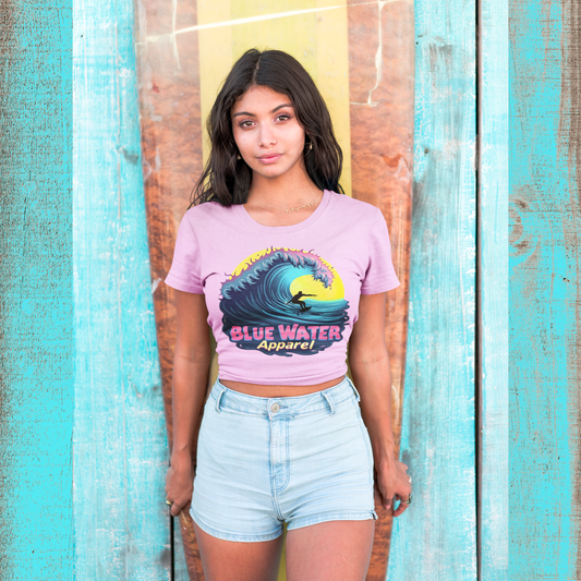 model with surfboard wearing lilac neon surfer tee by blue water apparel