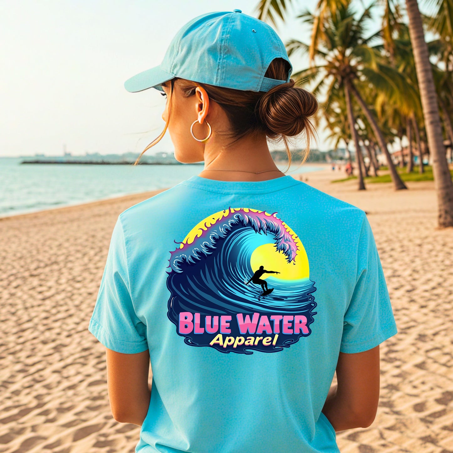 female model on beach wearing turquoise neon surfer tee by blue water apparel