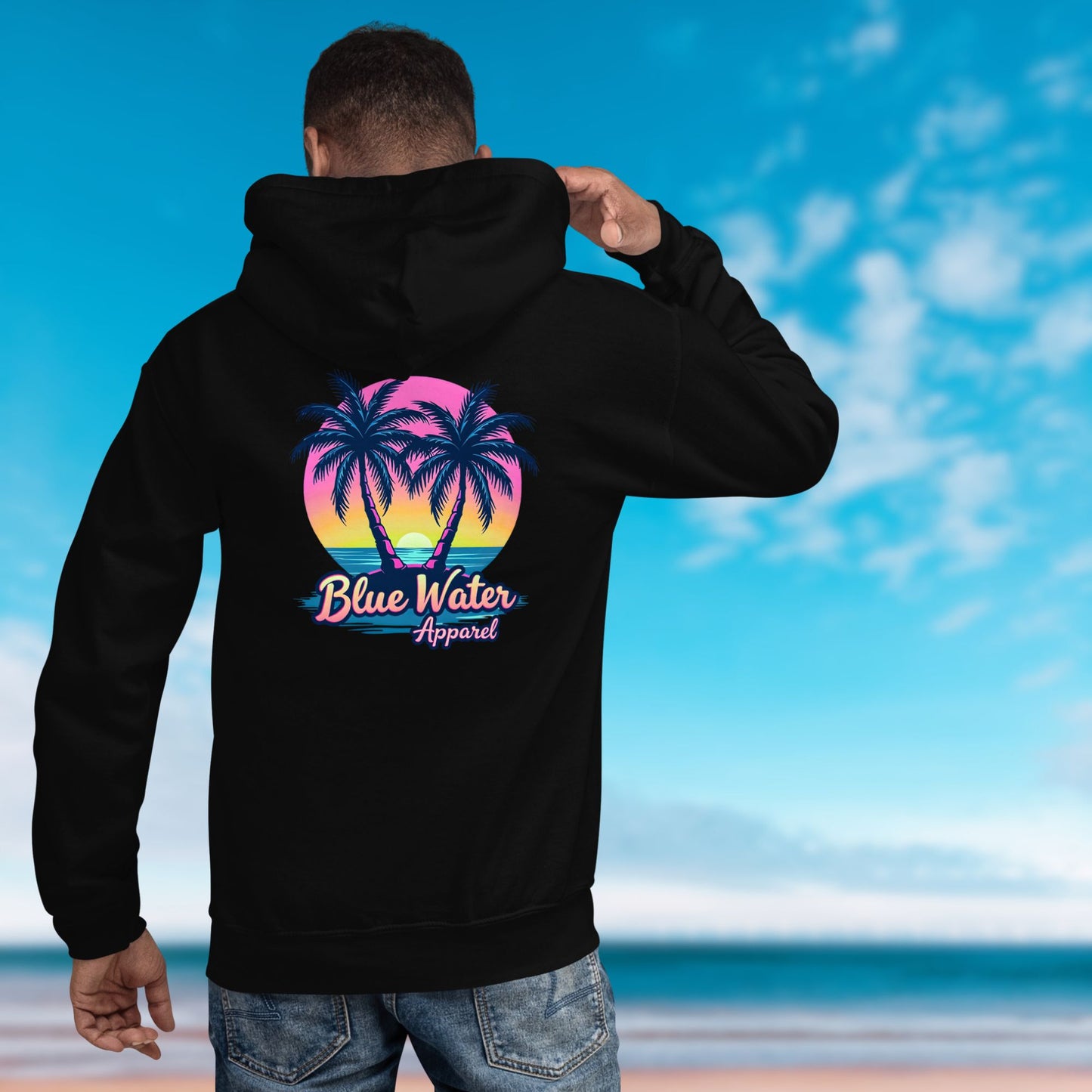 model on beach wearing black neon tropics hoodie by blue water apparel