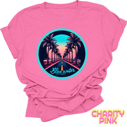 flat lay front graphic charity pink palm tree road tee by blue water apparel