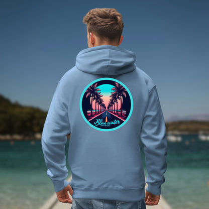 model on ocean pier wearing indigo blue palm tree road hoodie by blue water apparel