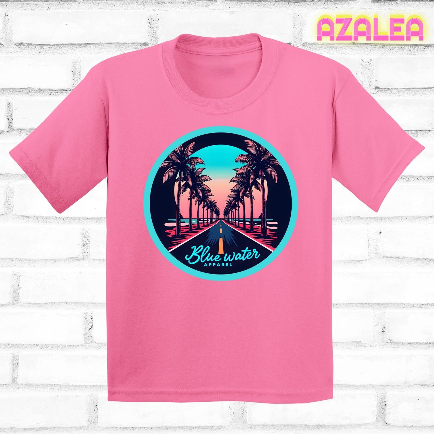 flat lay of azalea palm tree road tee by blue water apparel