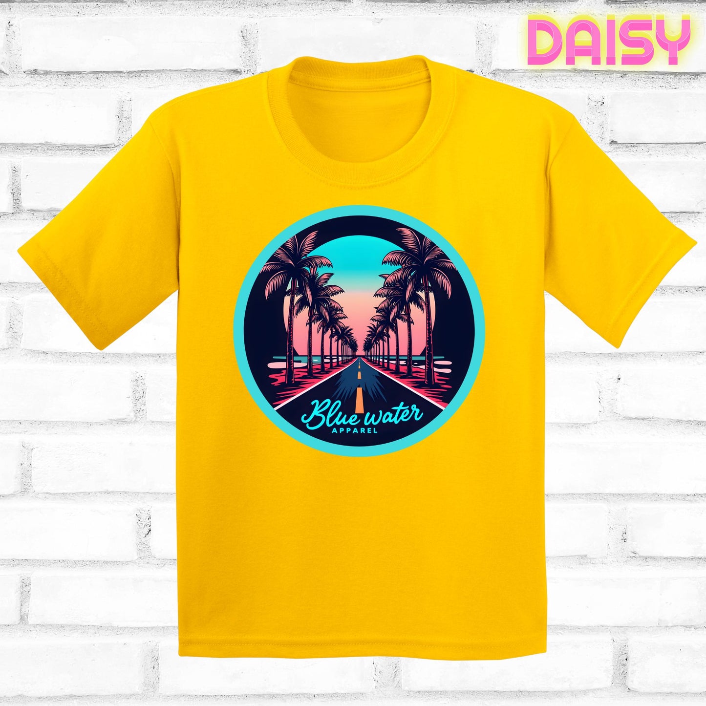 flat lay of daisy palm tree road tee by blue water apparel