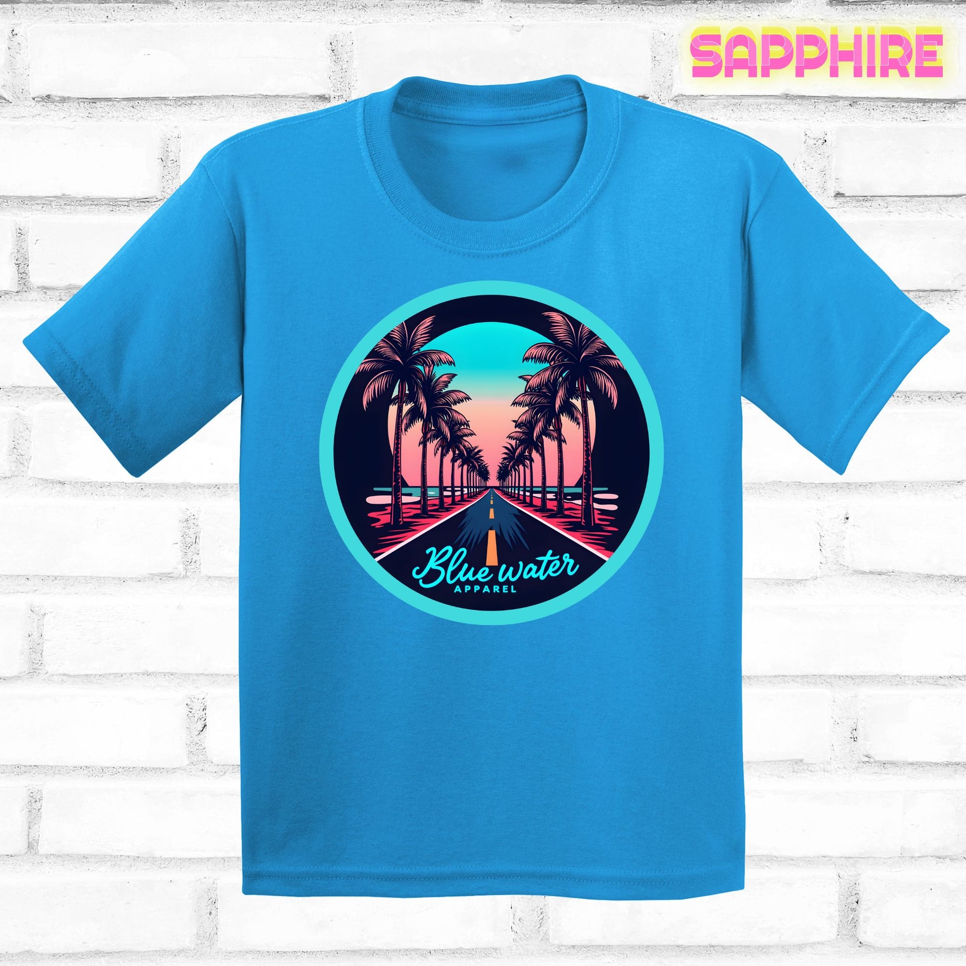 flat lay of sapphire palm tree road tee by blue water apparel