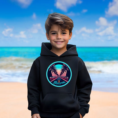 male model on beach wearing black palm tree road kids hoodie by blue water apparel
