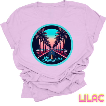 flat lay front graphic lilac palm tree road tee by blue water apparel