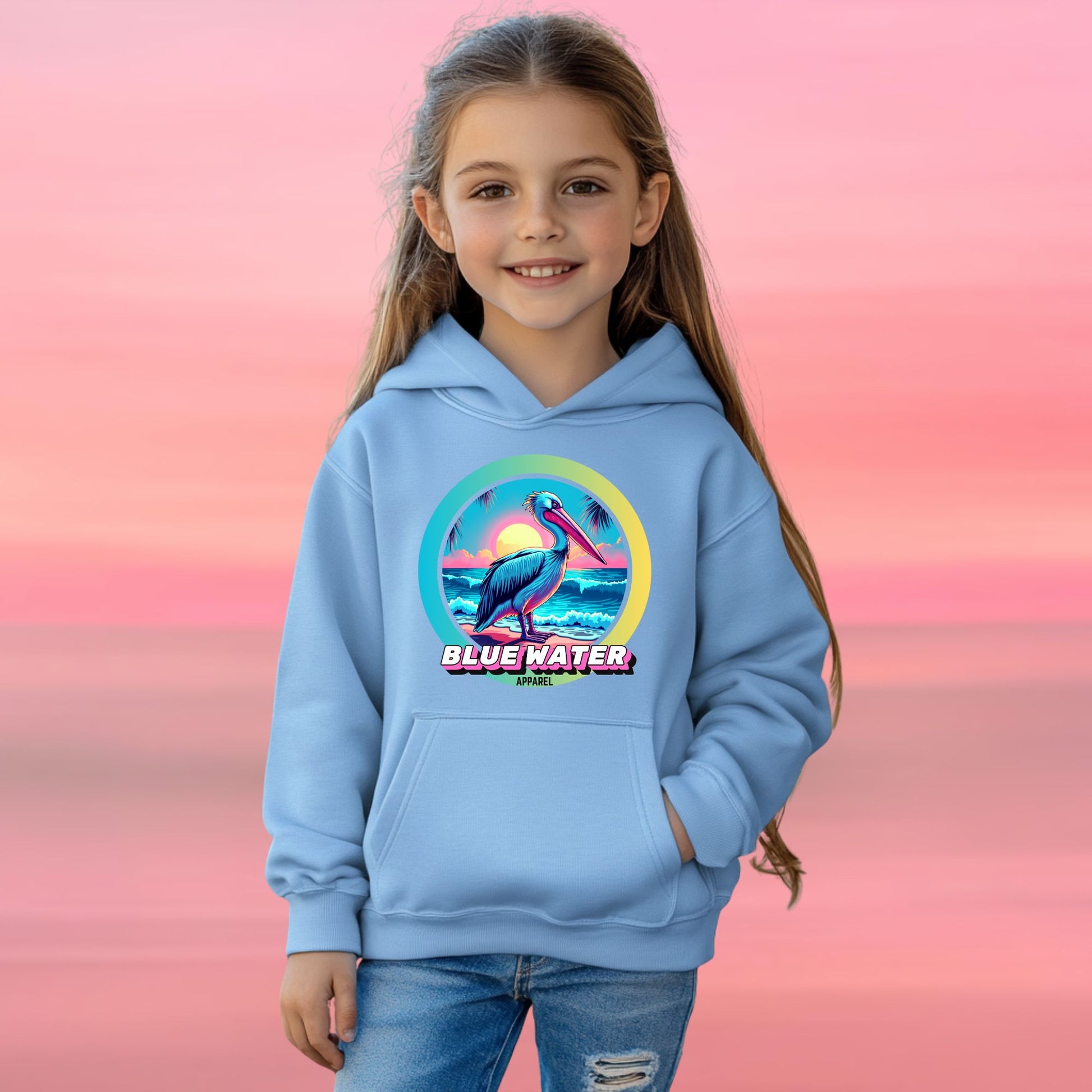 female model on beach wearing carolina blue retro pelican kids hoodie by blue water apparel