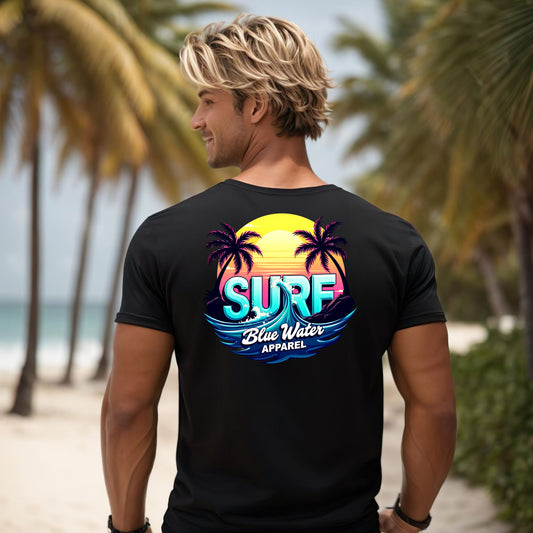 male model on beach wearing black retro surf tee by blue water apparel
