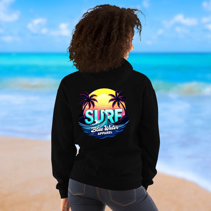 woman on beach wearing black retro surf hoodie by blue water apparel