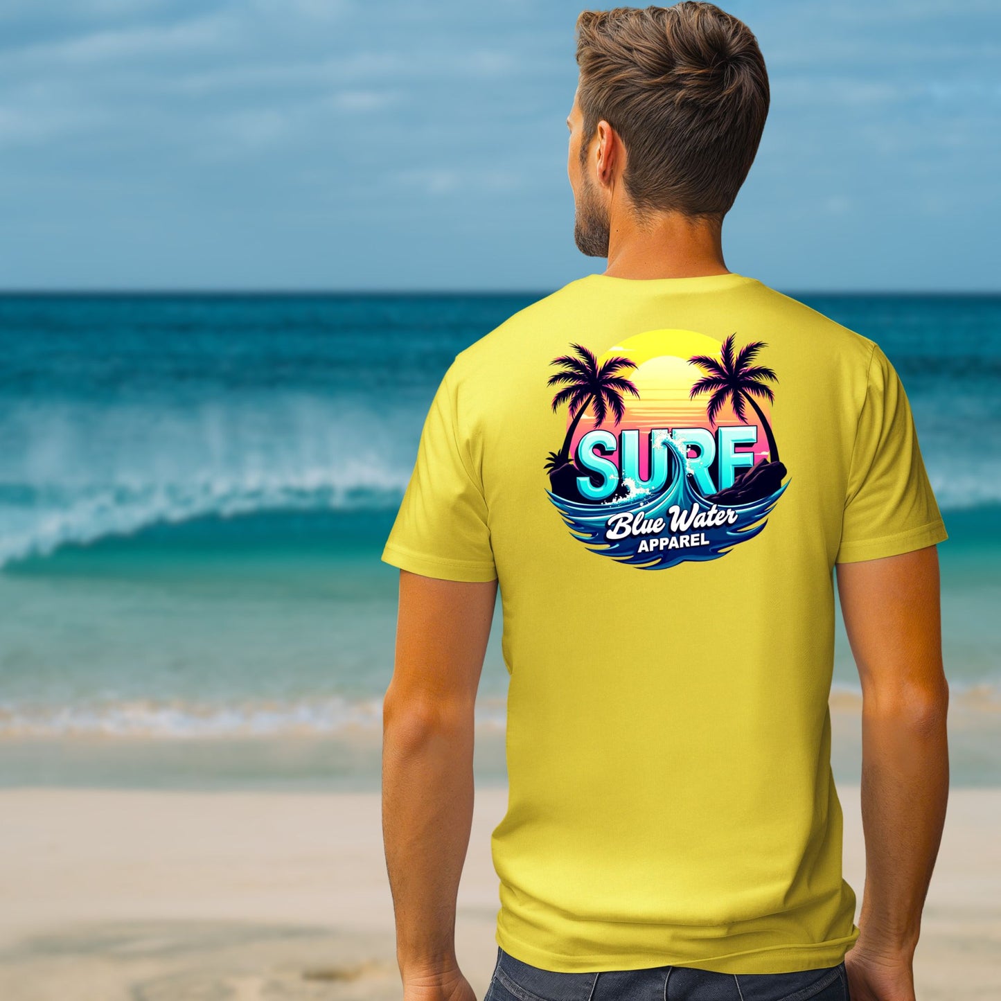 male model on beach wearing yellow retro surf tee by blue water apparel