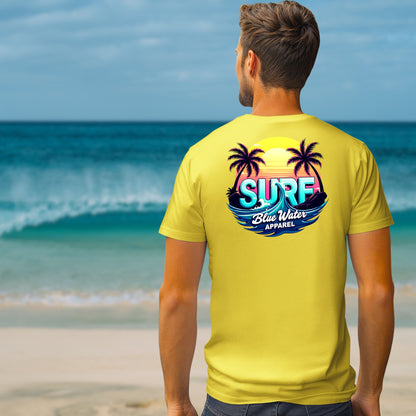 male model on beach wearing yellow retro surf tee by blue water apparel