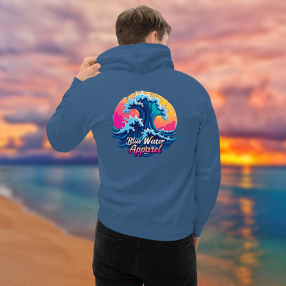 man on beach holding hoodie up of indigo blue retro wave hoodie by blue water apparel.