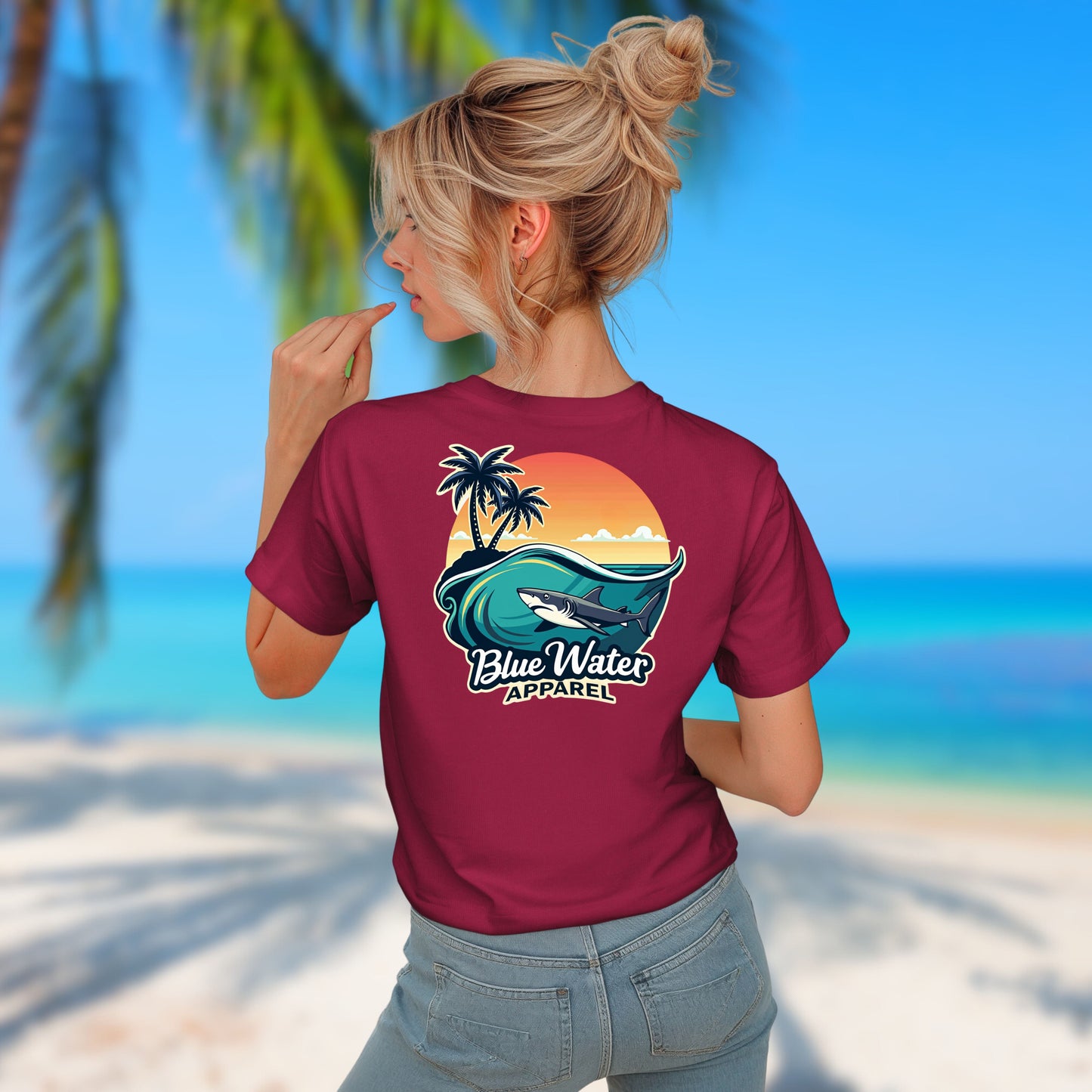 model on beach wearing cardinal shark wave tee by blue water apparel