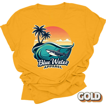 flat lay front graphic shark wave gold tee by blue water apparel