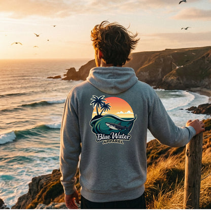man wearing sport grey shark wave adult hoodie standing on seaside cliff by blue water apparel
