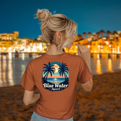 model on beach wearing autumn tropical moon tee by blue water apparel