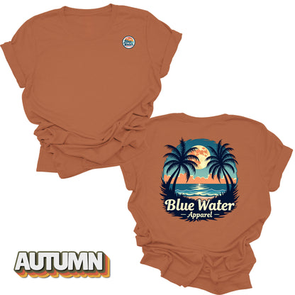 front and back flat lay of autumn tropical moon tee by blue water apparel