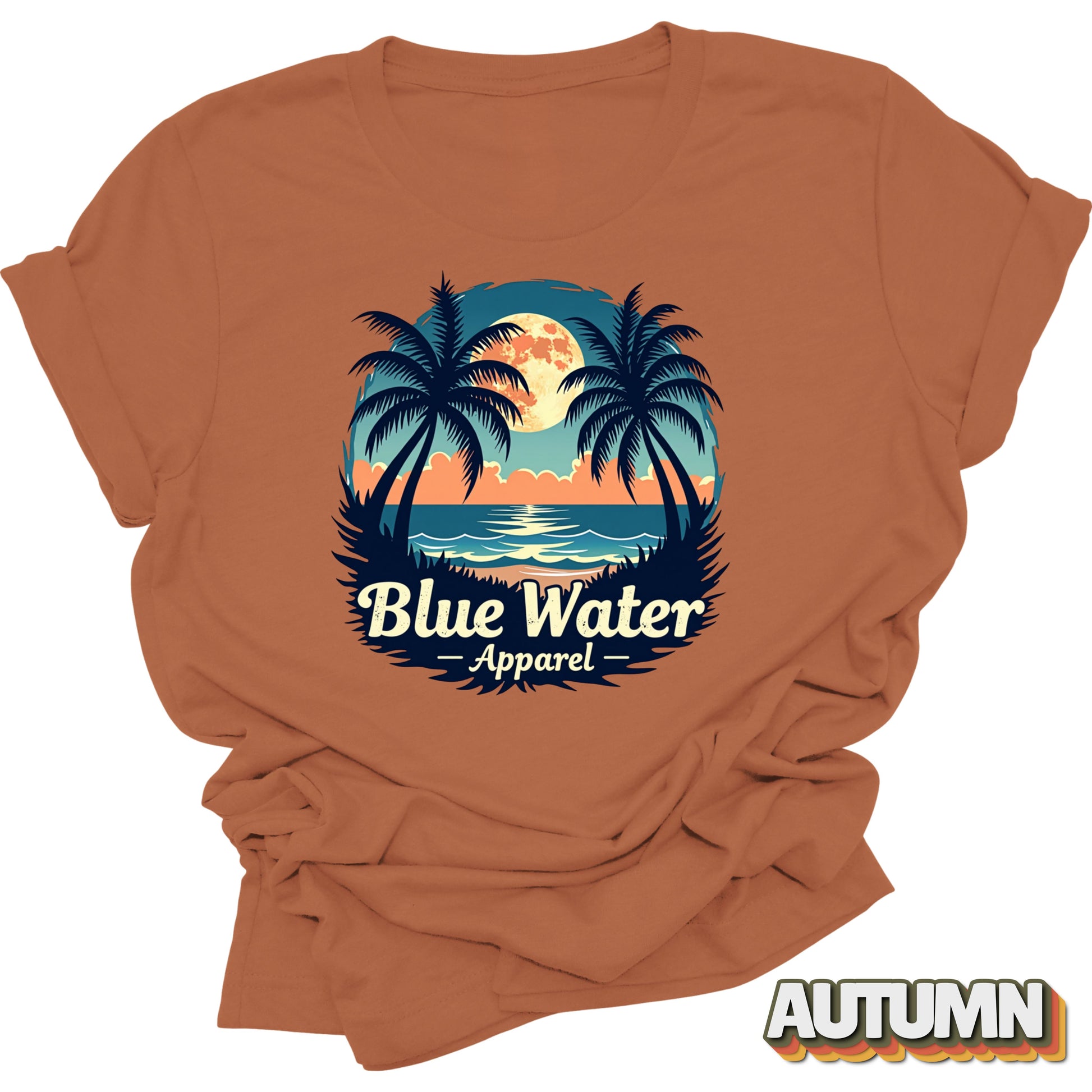 flat lay front graphic of autumn tropical moon tee by blue water apparel