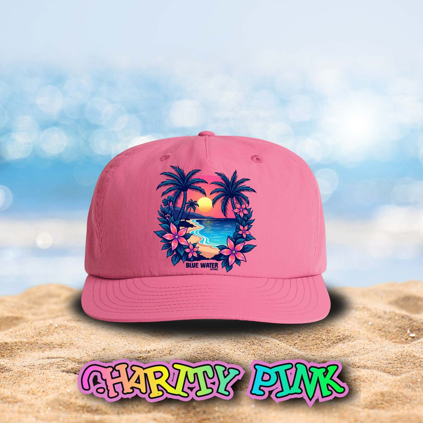 flat lay charity pink tropical sunset surf cap on beach by blue water apparel
