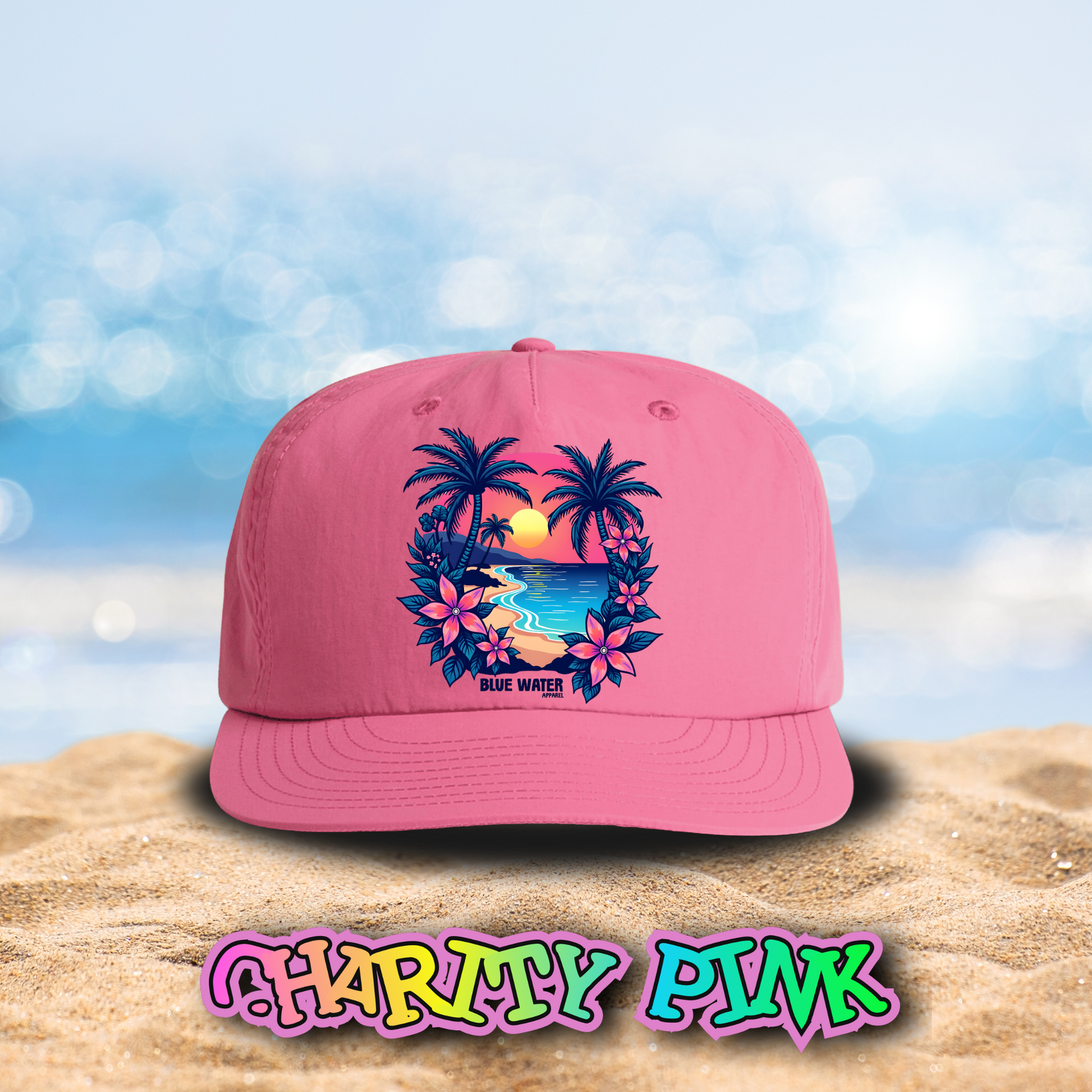 flat lay charity pink tropical sunset surf cap on beach by blue water apparel