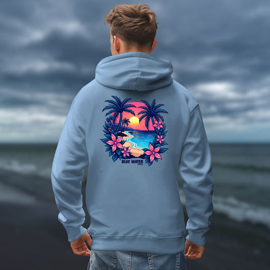 male model on dark beach wearing indigo blue tropical sunset hoodie by blue water apparel