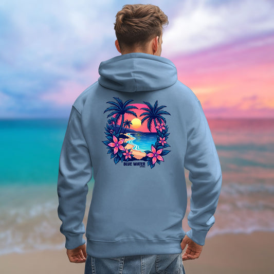 model on beach wearing indigo blue tropical sunset hoodie by blue water apparel
