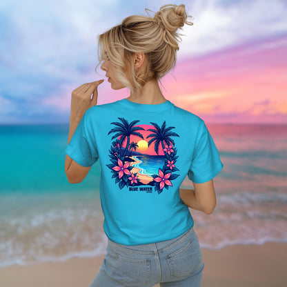 model on beach wearing turquoise tee by blue water apparel