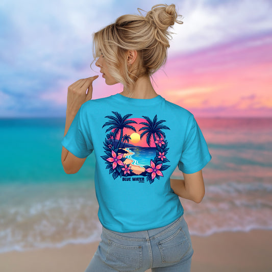 model on beach wearing turquoise tee by blue water apparel