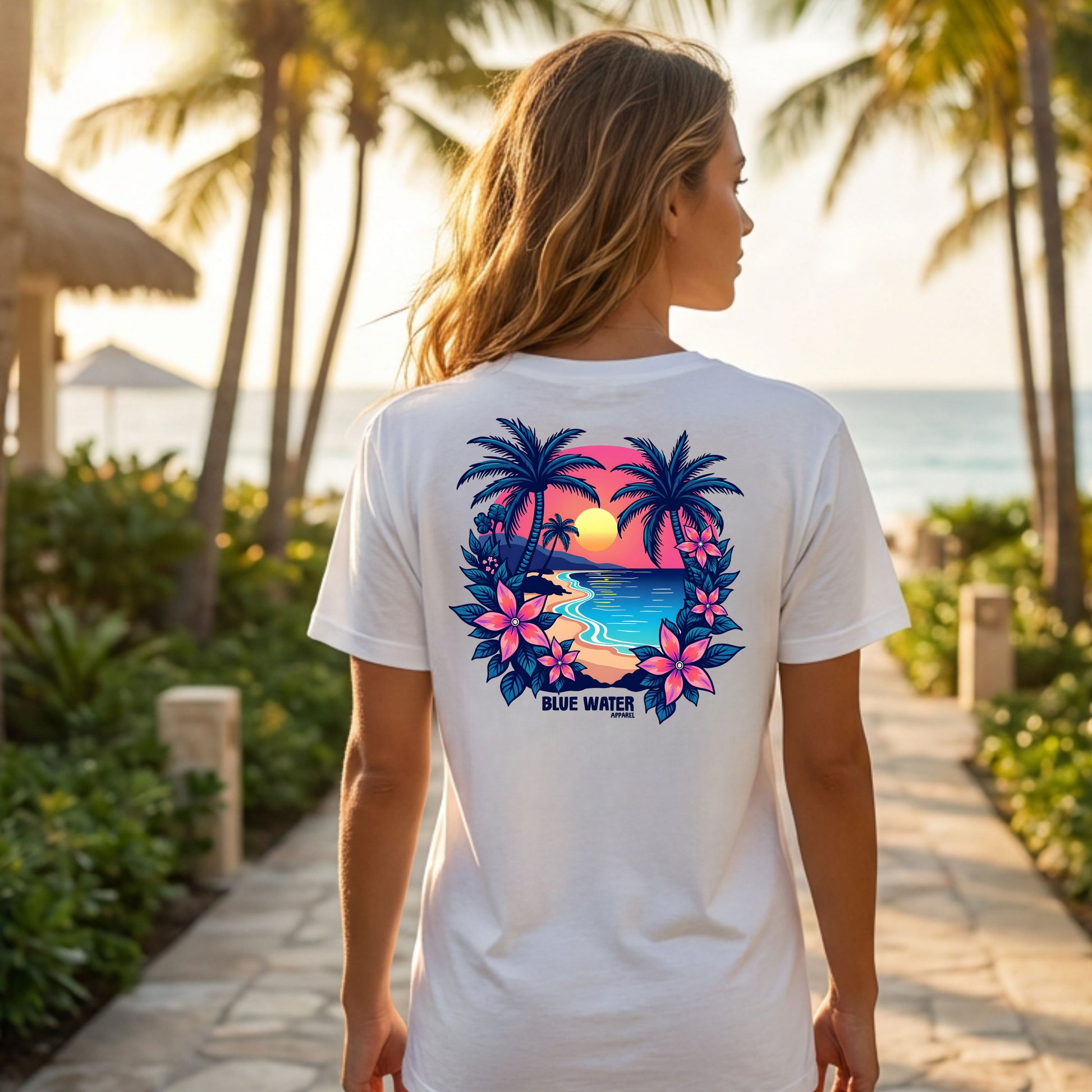 model wearing white tropical sunset adult tee on beach resort sidewalk by blue water apparel