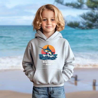 child model on beach wearing sport grey vintage marlin kids hoodie by blue water apparel