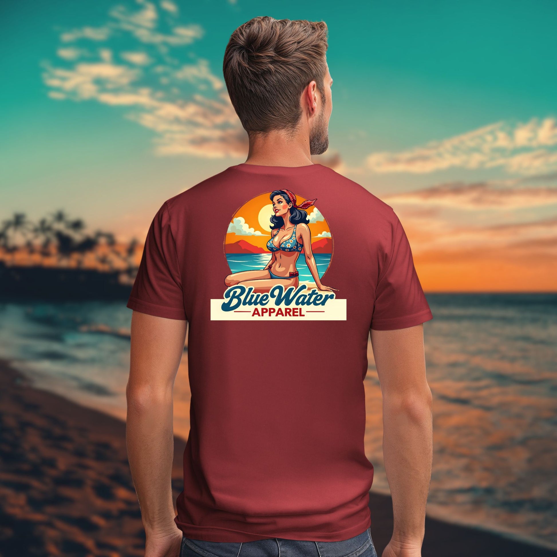 Model facing ocean wearing a cardinal vintage pinup tee by blue water apparel