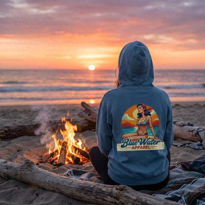 Woman wearing indigo blue Vintage Pin-Up hoodie beach bonfire lifestyle by Blue Water Apparel