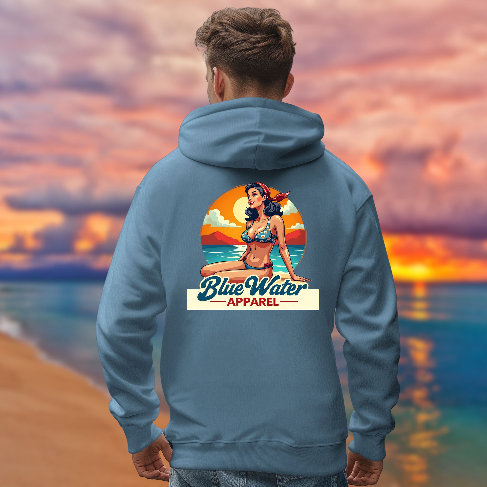 male model on beach wearing indigo blue vintage pin up hoodie by blue water apparel