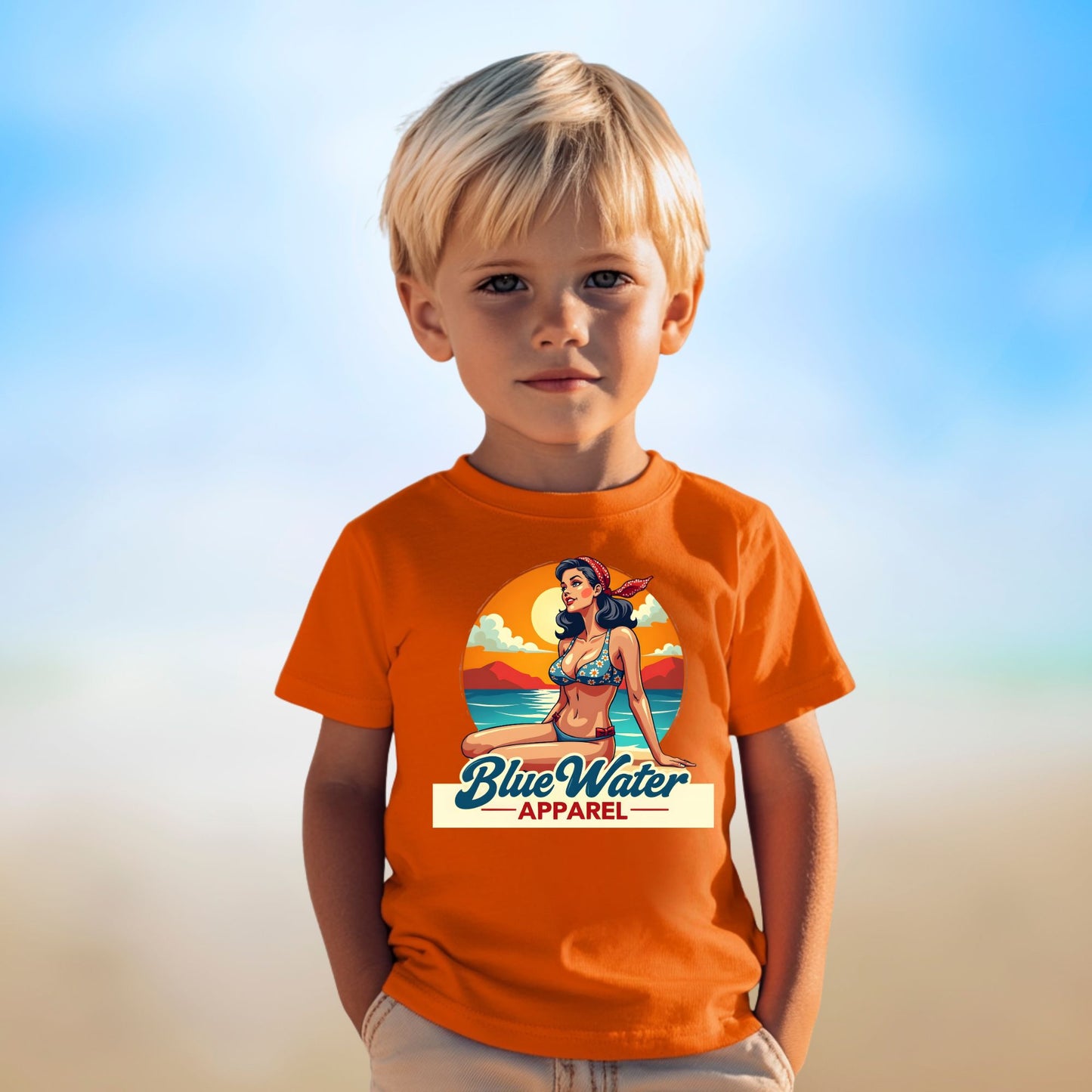 Young boy wearing orange vintage pin-up tee by Blue Water Apparel