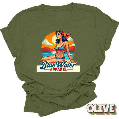 Flat lay of olive vintage pin up graphic by Blue Water Apparel