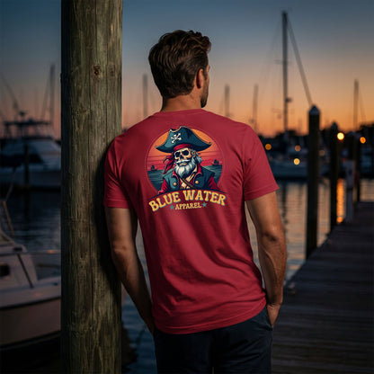 model wearing cardinal vintage pirate adult tee leaning against a pier post by blue water apparel