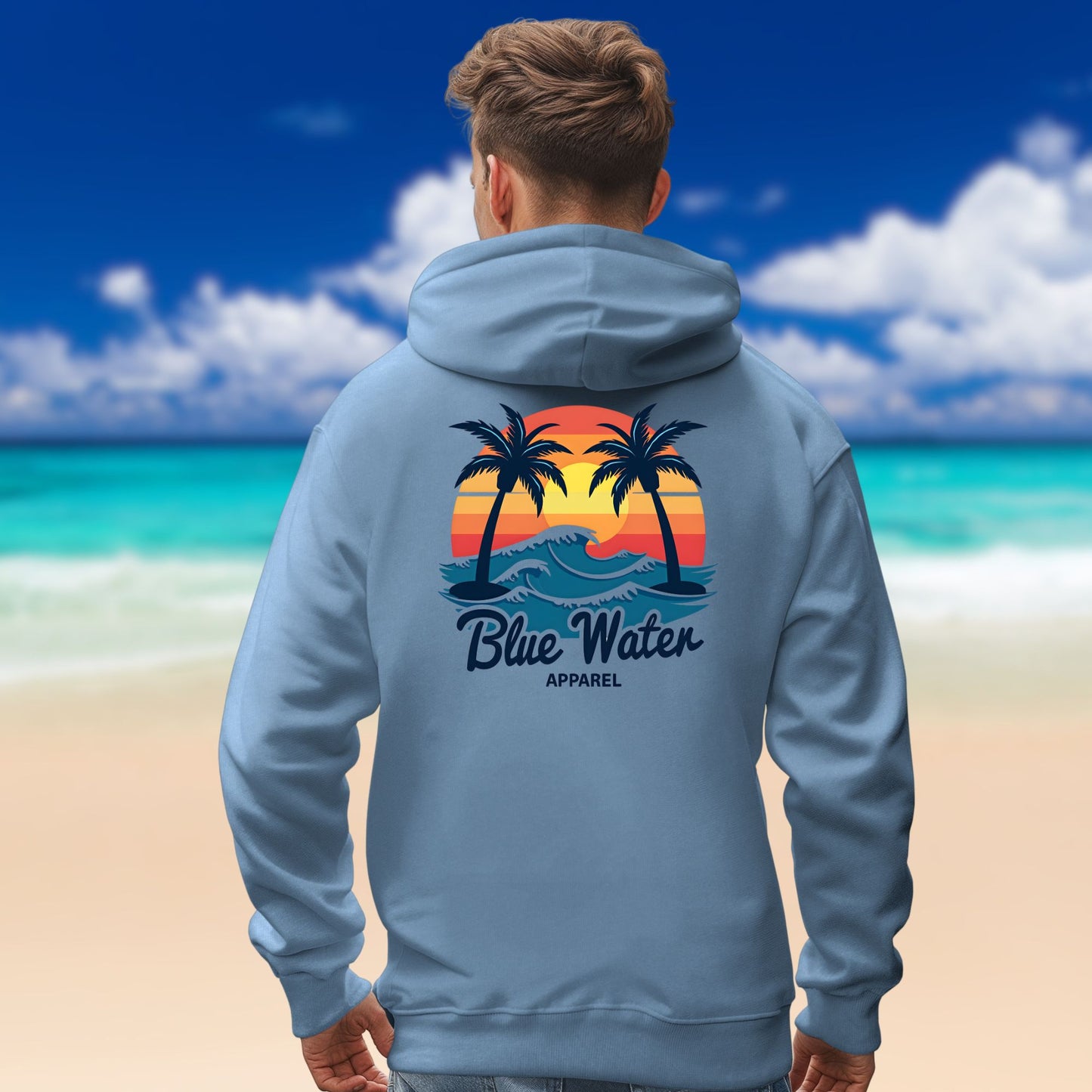 man on beach wearing indigo blue vintage sunset hoodie by blue water apparel