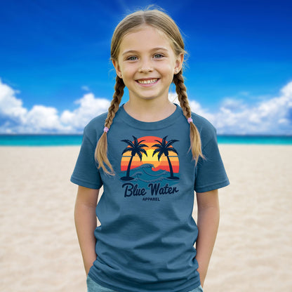female child on beach wearing indigo blue vintage sunset tee by blue water apparel