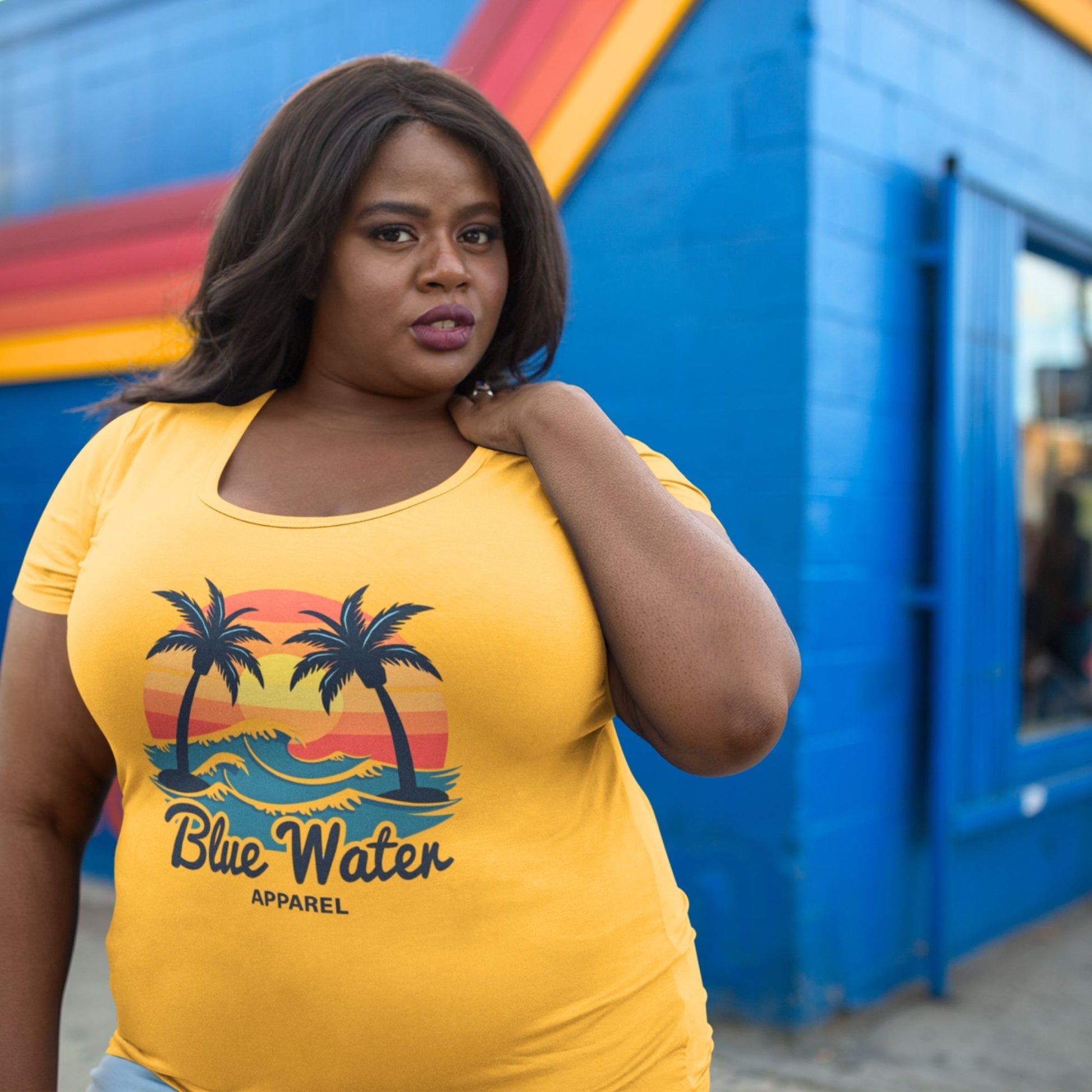female model wearing a mustard Vintage Sunset tee by blue water apparel