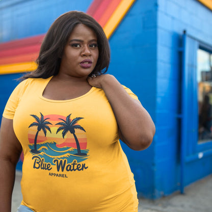 female model wearing a mustard Vintage Sunset tee by blue water apparel
